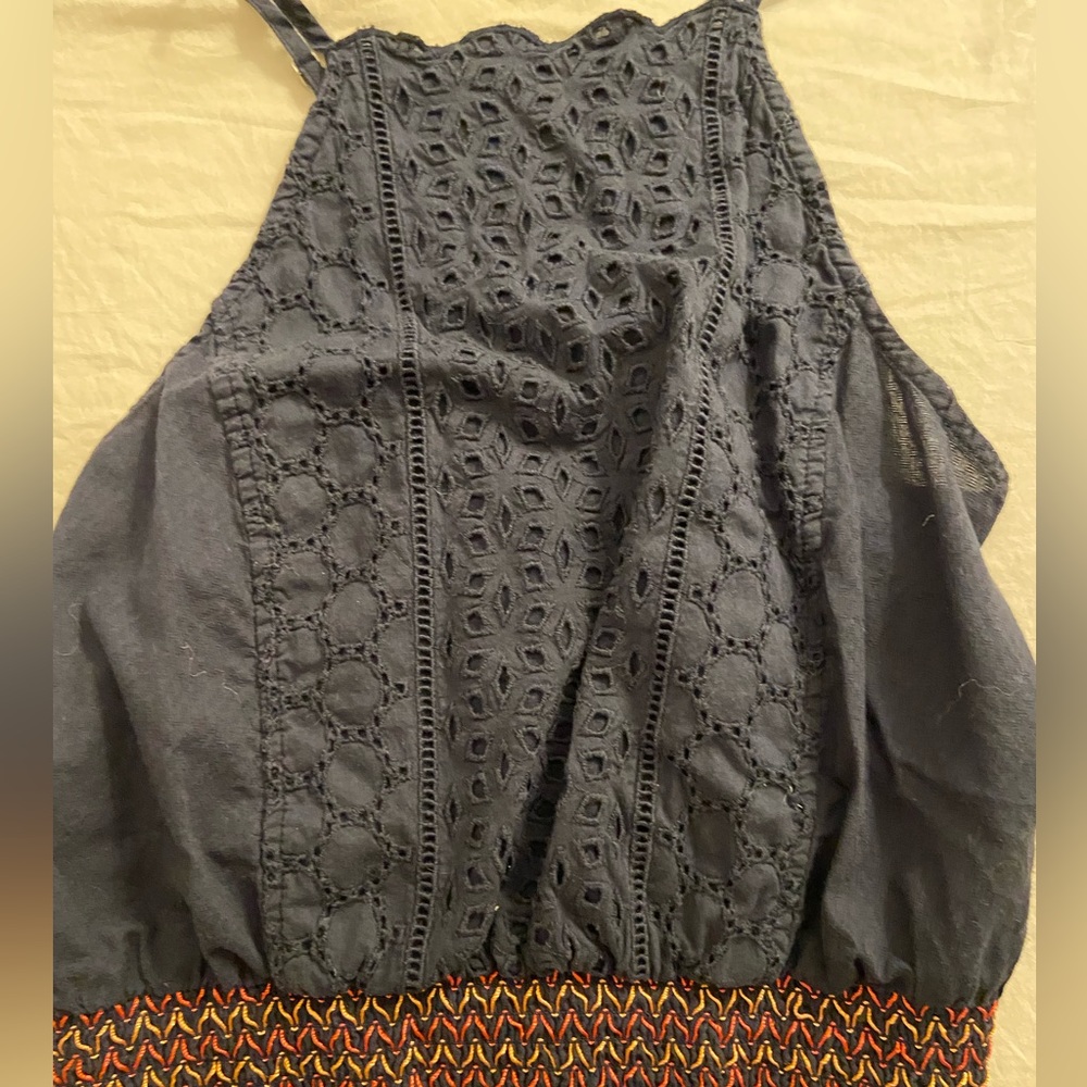 Blue hollister top with orange and pink stitching on the bottom